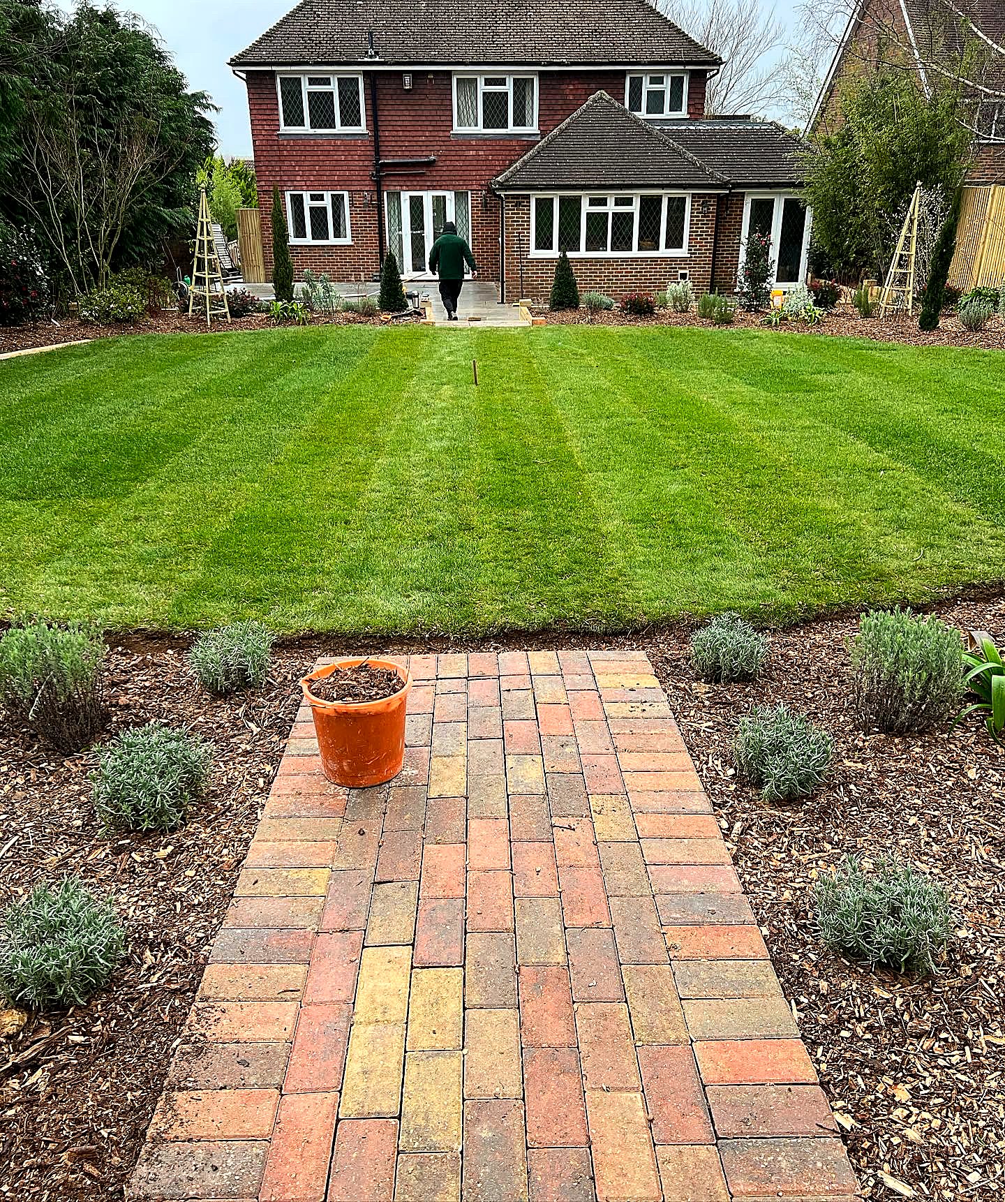 Timber decking and raised beds, built to sit with the planting.