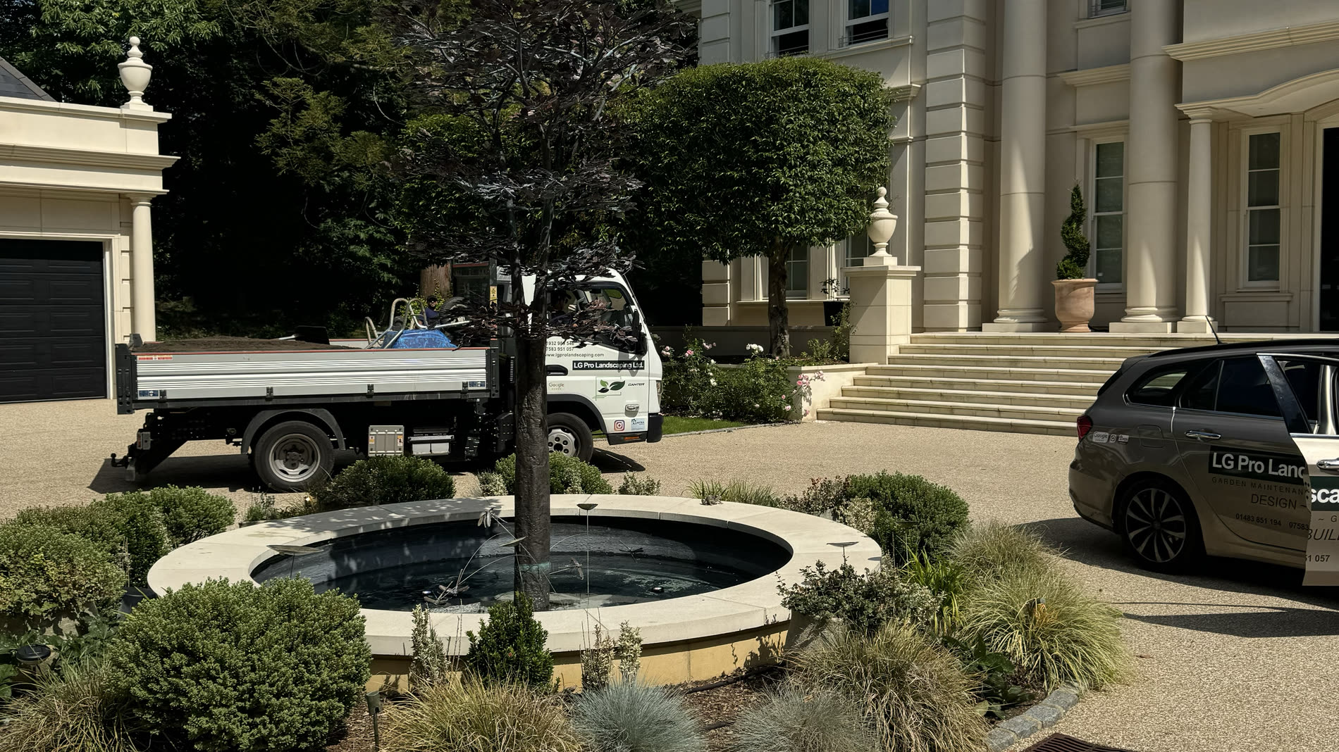 An established Surrey garden with mature planting and a neatly kept lawn